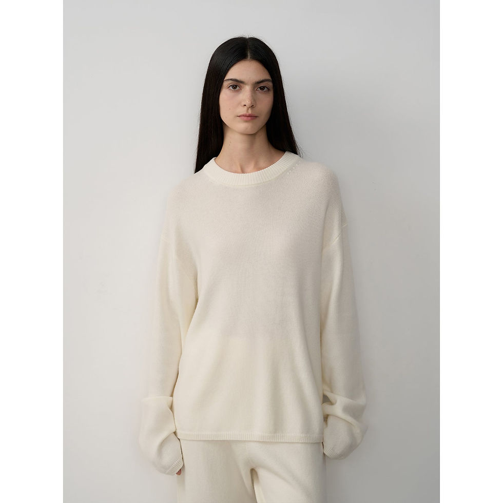 Thumbnail: Model wearing cream Basalan Merino co-ord set with crewneck sweater, front-facing