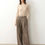 Thumbnail: Front view of high-waisted wool suiting trousers with side seam pleats, showcasing a clean waistband and straight-leg silhoue