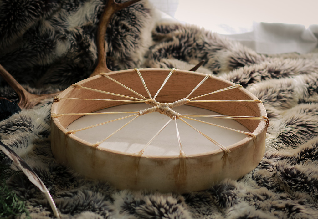 Custom shamanic drum on altar, handmade in UK