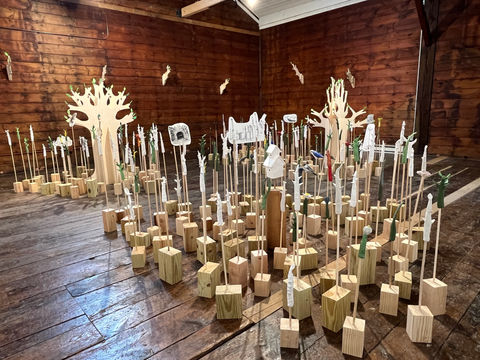 Sculptural installation with plywood trees, double sided drawings, ceramic branches, birds and flowers, wood blocks and paper leaves 