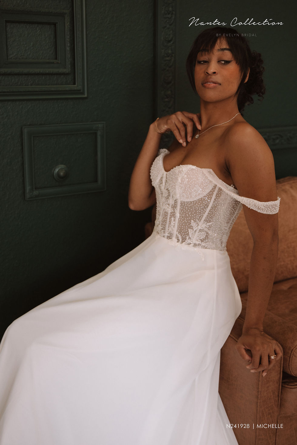 Thumbnail: Michelle | N241928
Gown Info
Embrace an aura of elegance with this sweetheart neckline dress. This dress is delicately adorned with shoulder straps, while the lower skirt features a chiffon A-line silhouette, offering a sense of graceful flow. The upper body is elegantly decorated with semi-sheer lace, crystal stone sequins, and Organza lace appliqué, lending a touch of opulence to the ensemble. To complete the look, the dress features crystal stone sequin-adorned shoulder straps, adding an extra layer of sophistication

Material
Chiffon/Lace

Color & Size
Shown in Ivory/Nude

Also available in Ivory/Ivory

Available Sizes: 2 - 28 / 14W - 32W Size Chart