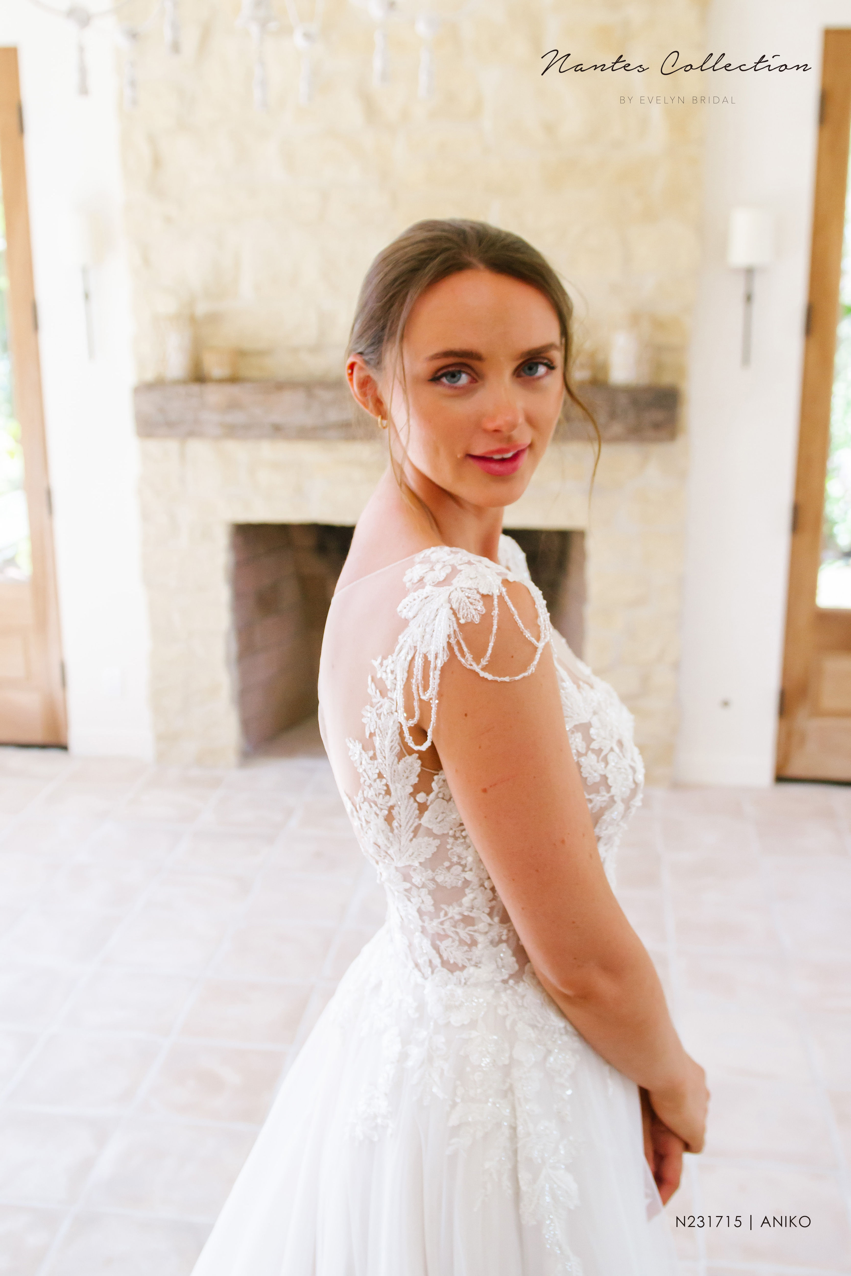 Aniko | N231715
Gown Info
Aniko was made to mesmerize! This lace and tulle ball gown is full of sweet and delicate details throughout. The lace applique with chandelier beading cap sleeves is one of our favorite features! An illusion V front neckline perfectly compliments the equally stunning illusion back plunging neckline with tulle keyhole. Lace appliques on the skirt and a chapel length train complete this beautiful gown.

Material
Lace/Tulle

Color & Size
Ivory/Nude

Ivory/Ivory

Sizes available - 2-28 / 14W-32W