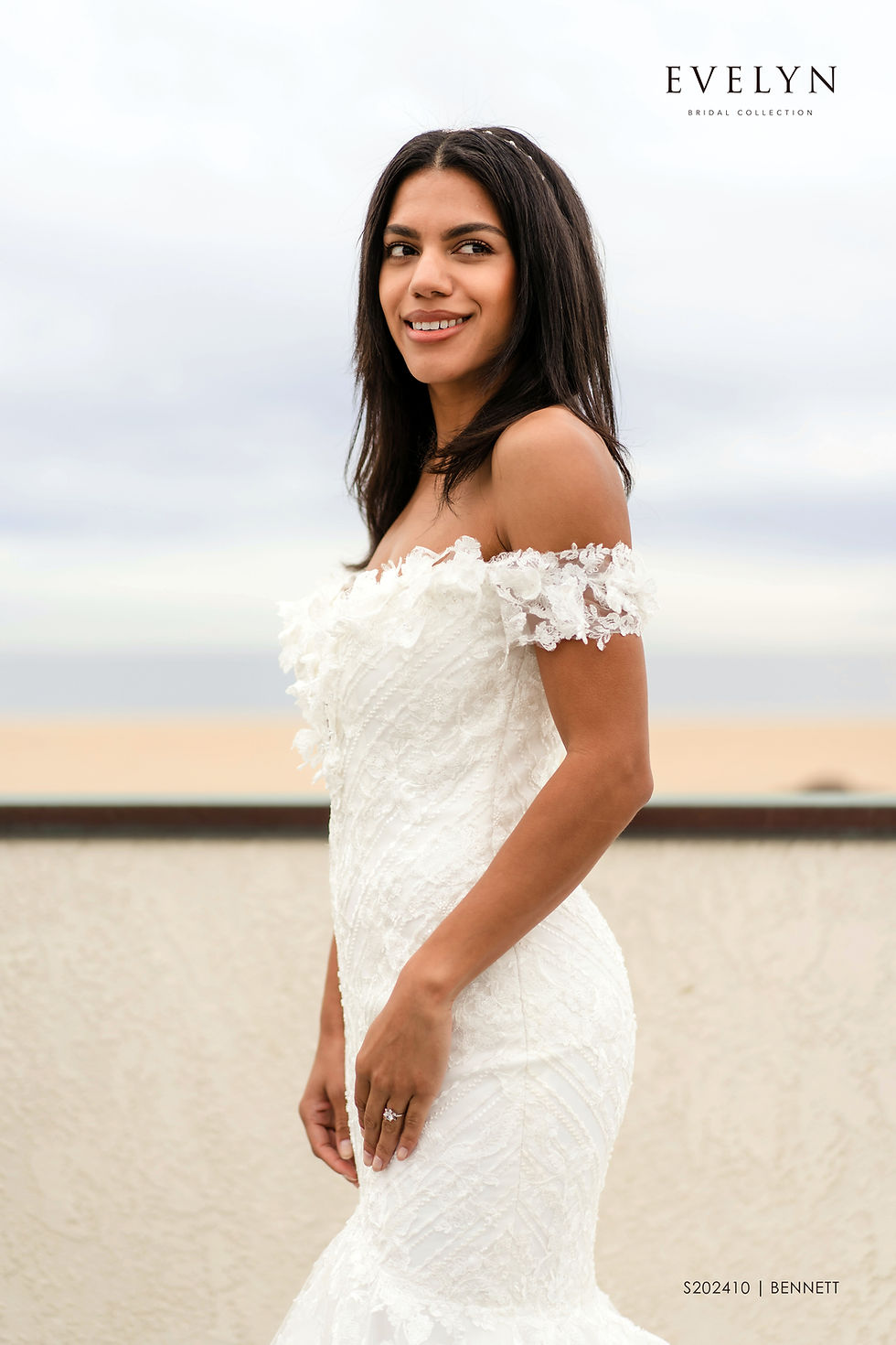 BENNETT | S202410
Gown Info
Stunning lace and tulle mermaid style gown with off-the-shoulder straps. The unique geometric line lace pattern on the gown is accented with butterfly-kissed floral laces on the plunging V neckline and straps while the tulle skirt extends out to a chapel length train.

Material
Lace

Tulle

 

Color & Size
Ivory

Sizes available in 2-28  / 14W-32W