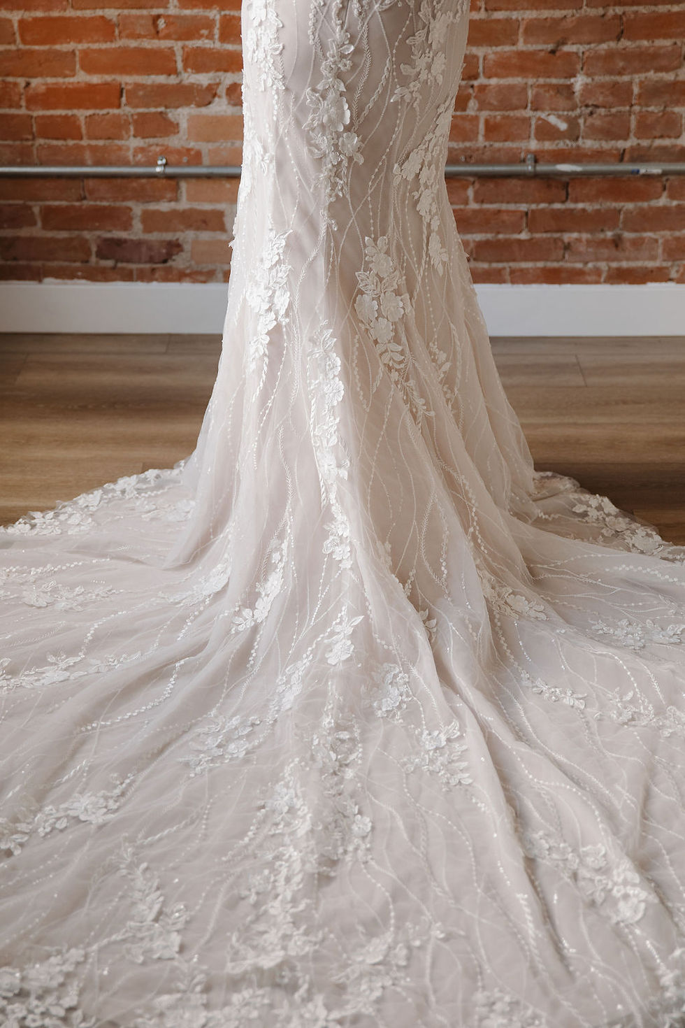 Thumbnail:  

Aurelia | S242111
Gown Info
Experience timeless elegance in this enchanting gown, where layers of delicate ivory lace, soft tulle, and a nude lining come together seamlessly. Intricate embroidery and 3D lace detail grace the sweetheart neckline, adding a touch of sophistication to the silhouette. Sleeveless and sleek, with a captivating mermaid skirt that gracefully hugs every curve, this gown promises to make a statement. Complete with a sleek straight train, it embodies grace and refinement, ensuring an unforgettable presence on your special day.

Material
Tulle

Color & Size
Shown in Ivory/Champagne

Available Sizes: 2 - 28 / 14W - 32W Size Chart