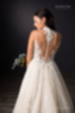 Thumbnail: Elegant lace and tulle ball gown with regal Queen Anne collar.

Gwendoline | S201361
Gown Info
Elegant lace and tulle ball gown with regal Queen Anne collar. The metalic sparkle lace adorns the unique front neckline to a deep V, while the back bodice features a low illusion scoop back and covered buttons. The chapel length tulle train is embellished with matching dazzling sparkle lace fanning out from waist line to the hem.

Material
Lace

Tulle

 

Color & Size
Ivory/Pearl/Ivory (Shown)

Ivory/Ivory

 

Sizes available in 2-28  / 14W-32W