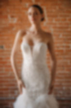 Thumbnail: Makenna | S242116
Gown Info
Enter a realm of timeless beauty with this ivory lace gown,, where delicate lace and soft tulle intertwine against a backdrop of nude lining. The lace detailing adorns the sweetheart deep V-neckline, imparting an ethereal charm to the silhouette. Sleeveless and graceful, with a captivating mermaid ruffle skirt, this gown promises to captivate hearts as you glide down the aisle. Complete with a sleek straight train, it exudes sophistication and grace, ensuring an unforgettable entrance on your special day.

Material
Tulle

Color & Size
Shown in Ivory/Ivory

Available Sizes: 2 - 28 / 14W - 32W Size Chart