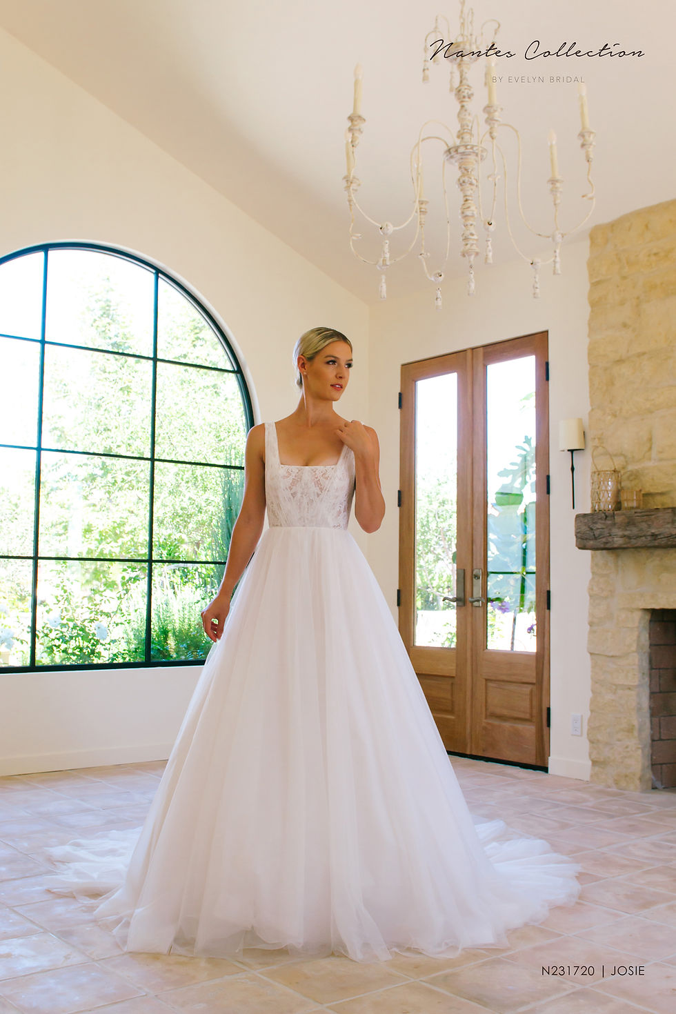 Josie | N231720
Gown Info
This lace and tulle sleeveless ball gown is pleasing to the eye with its soft square neckline. The lace pleat over overlace and chapel length train makes Josie a classic and elegant choice for all brides to feel beautiful in on their big day.

Material
Lace/Tulle

Color & Size
Ivory/Nude

Sizes available - 2-28 / 14W-32W
