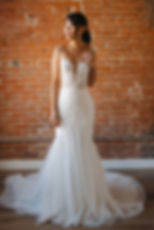 Goldie | S242103
Gown Info
Embark on an enchanting journey with this gown that features delicate layers of tulle and lace intertwine to create a mesmerizing effect. Intricate embroidery, adorned with shimmering glass beads and transparent tubes, graces the deep V-neckline, infusing the silhouette with ethereal charm. With its sleek mermaid skirt and graceful straight train, this gown epitomizes timeless beauty on your special day.

Material
Tulle/Lace

Color & Size
Shown in Ivory/Light Champagne

Also available in Ivory/Ivory

Available Sizes: 2 - 28 / 14W - 32W Size Chart