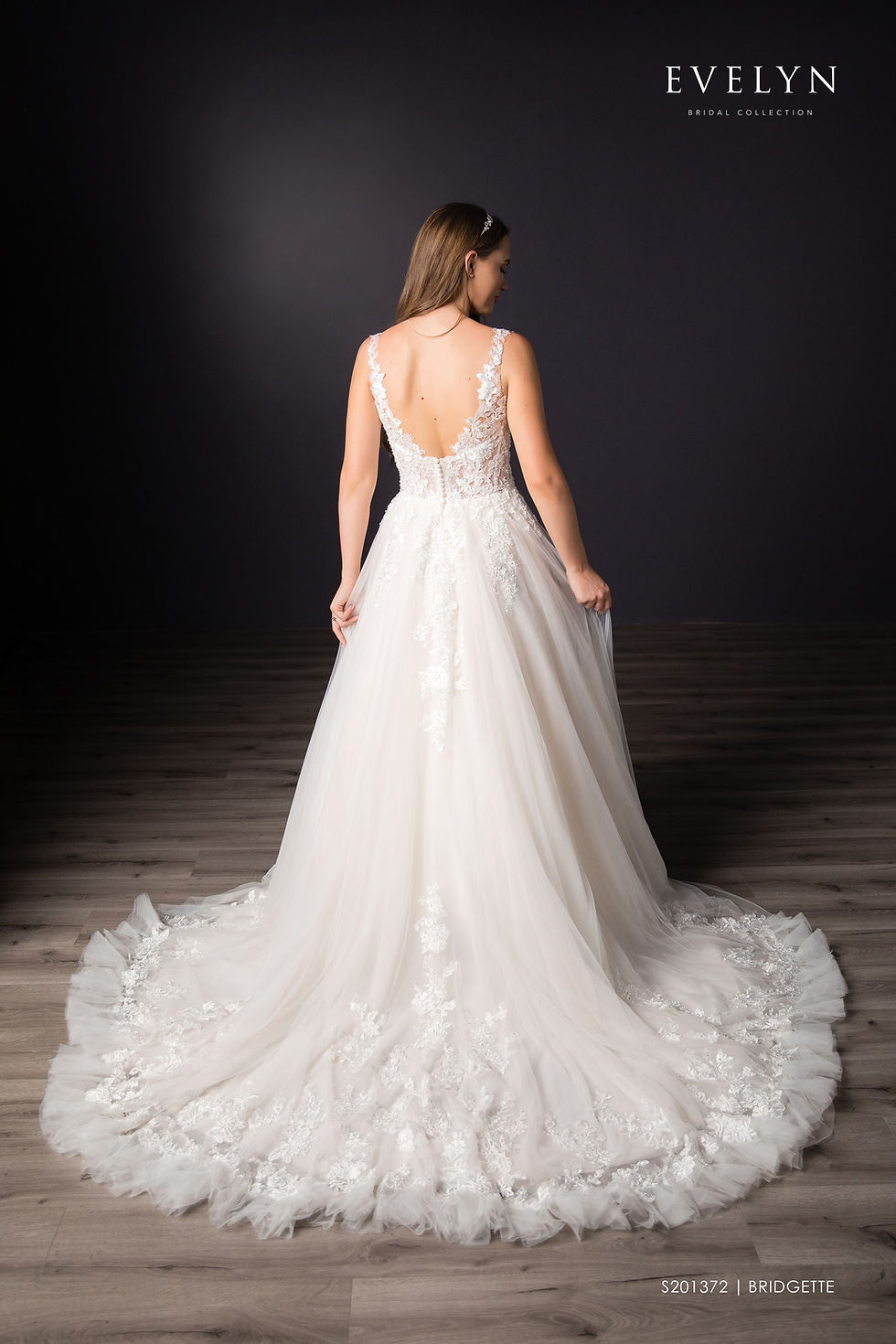 Thumbnail: Bridgette | S201372
Gown Info
A classic elegant and fashionable tulle ball gown with lace straps and train, and the perfect amount of ruffle details. The bodice offers laced straps that lead into the ruffles located on the front cut of the bodice. The lace in the bodice and end of train ties the dress together and creates a delicate finish. The perfect chapel length train finished off this style.

Material
Lace

Tulle

 

Color & Size
Ivory/Pearl (Shown)

Ivory/Ivory

 

Sizes available in 2-28  / 14W-32W