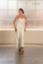 Thumbnail: Ava | S241903
Gown Info
Introducing our airy feathered jumpsuit - this jumpsuit features a heart-shaped bodice crafted from delicate crepe fabric adorned with fun feather details. The lower half features stylish pants, complete with a crepe waistbelt and a rose-gold buckle. Designed with a concealed back zipper, this ensemble exudes effortless elegance for your special day.

Material
Crepe & feather

Color & Size
Shown in Ivory/Nude

Also available in Ivory/Ivory

Available Sizes: 2 - 28 / 14W - 32W Size Chart