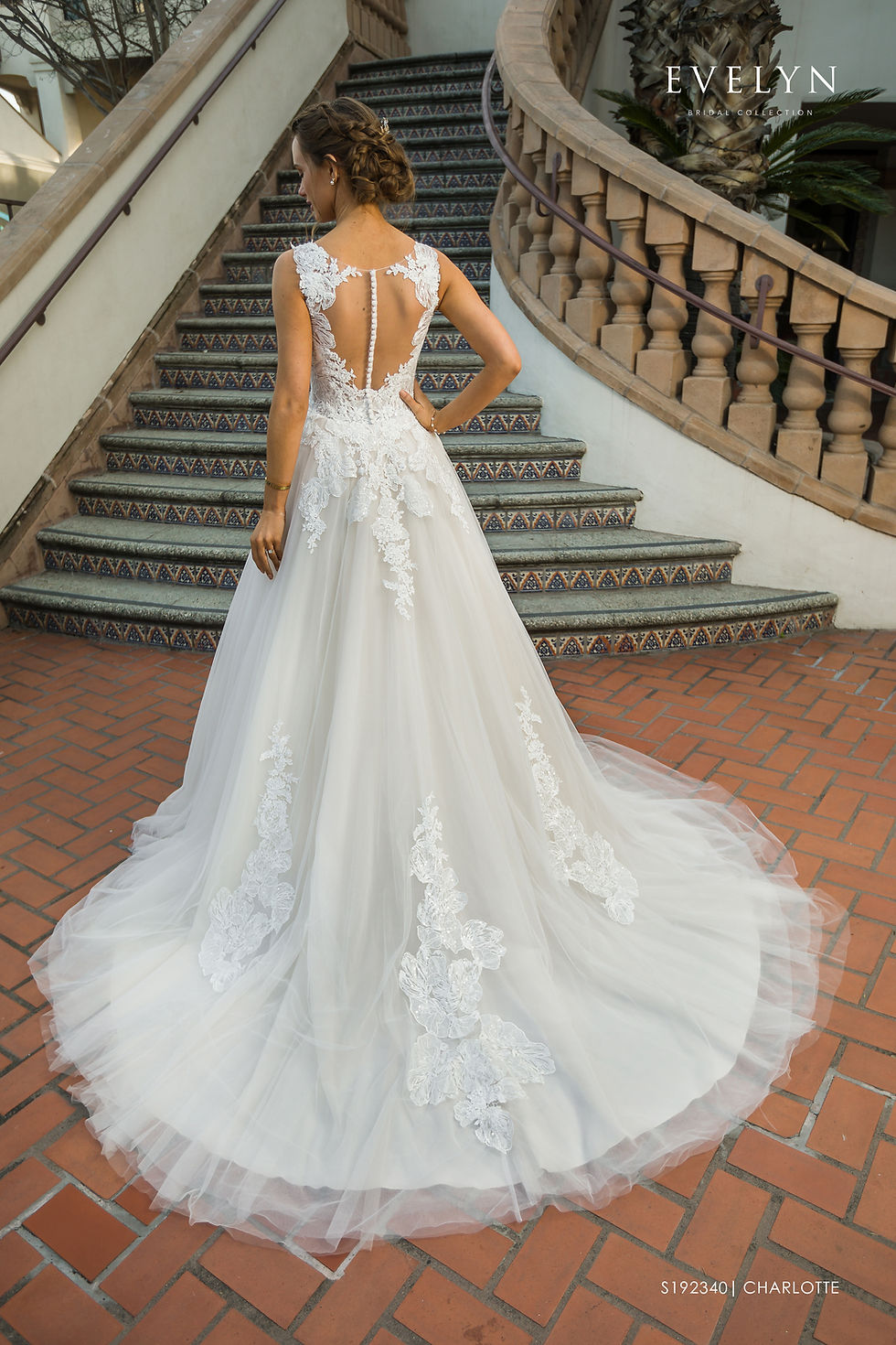 Thumbnail: Charlotte | S192340
Gown Info
Beautiful tulle ball gown with lace sheer bodice. The gown features an illusion V neckline with sequins embellished lace appliques, an open keyhole back adorned with covered buttons, asymmetrical cascading lace appliques from the waist line, and shimmering floral lace appliques on the chapel length train.

Material
Tulle

Lace

 

Color & Size
Ivory/Champagne (Shown)

Ivory

 

Sizes available in 2-28  / 14W-32W