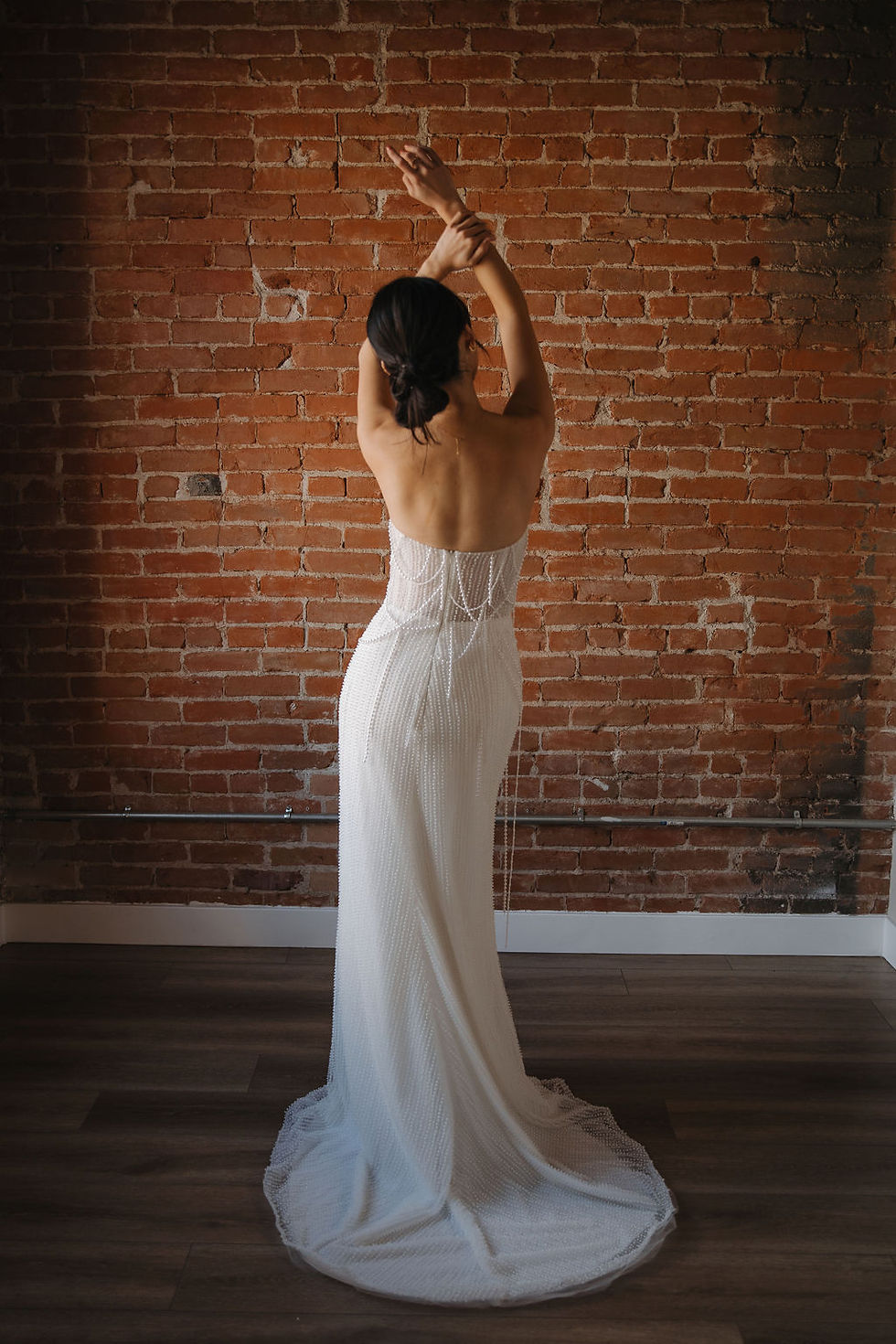 Thumbnail: Celeste | S242113
Gown Info
Elevate your bridal style with this stunning gown, crafted from beaded fabric complemented by layers of ivory tulle and nude lining. The sweetheart neckline exudes timeless elegance, while the absence of lace allows the intricate pearl embellishments to take center stage. Sleeveless and sleek, with a figure-flattering mermaid skirt that accentuates your silhouette, this gown promises to make a statement. Complete with a sleek straight train, it epitomizes sophistication and grace, ensuring an unforgettable presence on your special day.

Material
Pearl/Tulle

Color & Size
Shown in Ivory/Champagne

Available Sizes: 2 - 28 / 14W - 32W Size Chart


