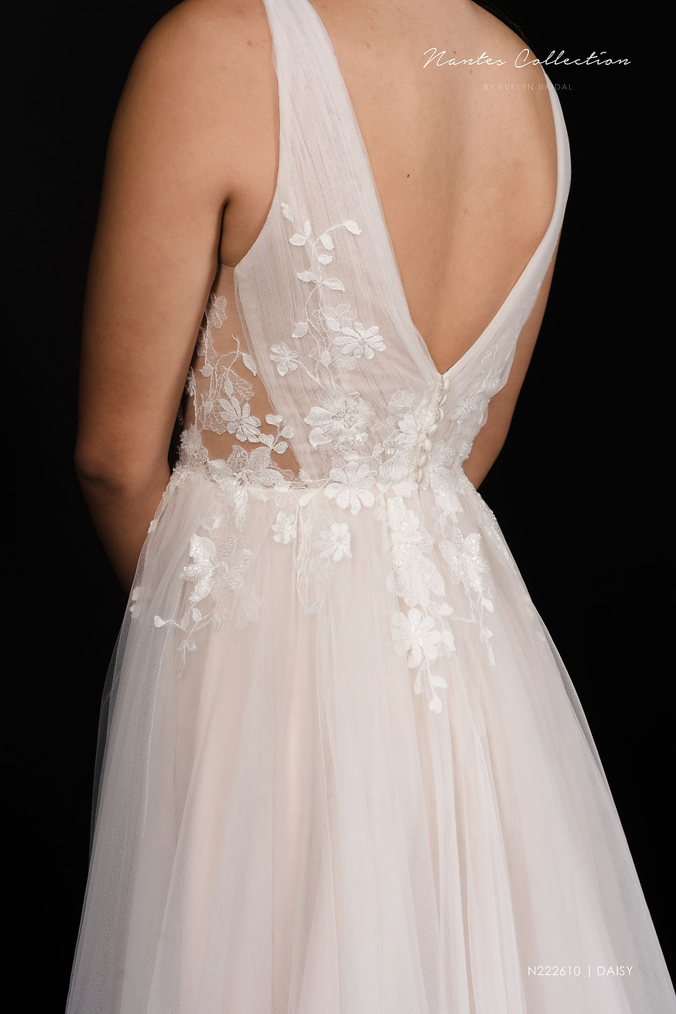Thumbnail: DAISY | N222610
Gown Info
For the utterly romantic, this light and airy tulle A-line gown features a soft tulle bodice and delicate lace embellishments. A low back and an impressive tulle skirt with a chic chapel length train complete the stunning look!

Material
Tulle

Color & Size
Ivory/Pink (Shown)

Ivory/Champange

 

Sizes available - 2-28  / 14W-32W