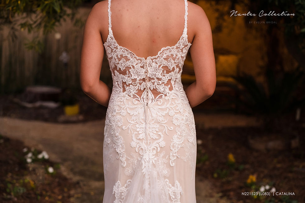 Thumbnail: Elegant fit and flare lace and tulle wedding dress.

CATALINA | N221523
Gown Info
A fit and flare lace and tulle wedding dress in an elegant style. The bodice features a deep V-neckline that is adorned with floral and scallop lace. The bodice also features delicate beaded spaghetti straps. The tulle skirt is embellished with floral appliques and features a dramatic train with matching scallop hem lace in a chapel length.

Material
Lace

Tulle 

 

Color & Size
Ivory/Nude (Shown)

Ivory/Ivory

Sizes available in 2-28  / 14W-32W