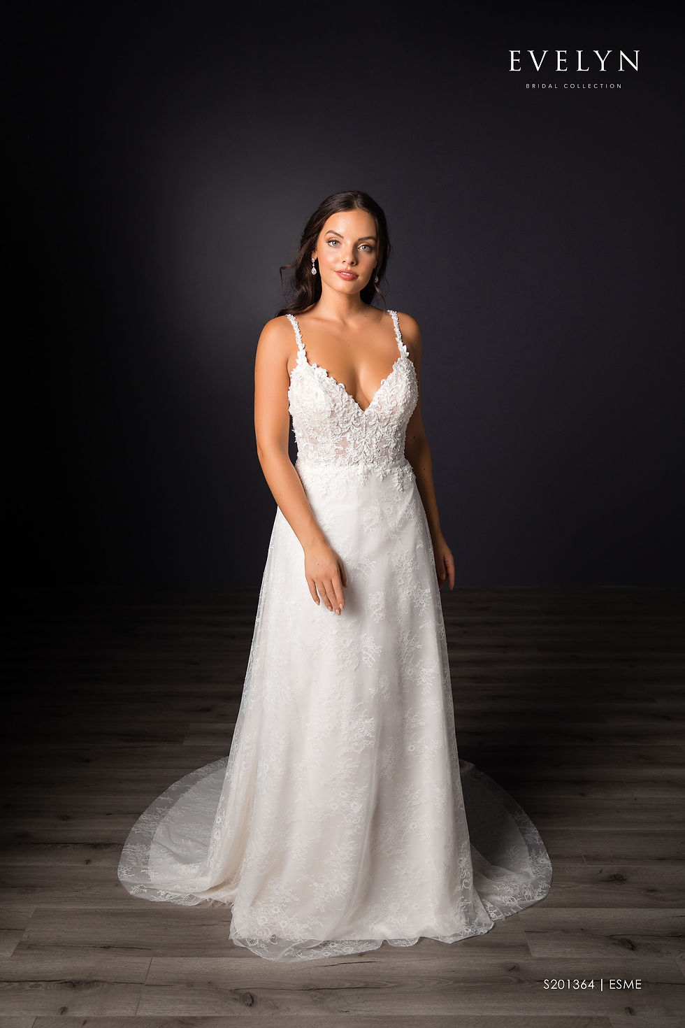 Thumbnail: Esme | S201364
Gown Info
Charming tulle and lace A-line gown with tulle topper. The bodice features a V neckline and lace embellished thin straps while the allover lace skirt fans out to a court length train. The dress can be worn with an elegant ruched tulle V-neck topper with lace embellishement at the shoulder.

Material
Lace

Tulle

 

Color & Size
Ivory/Nude/Ivory (Shown)

Ivory/Ivory

 

Sizes available in 2-28  / 14W-32W