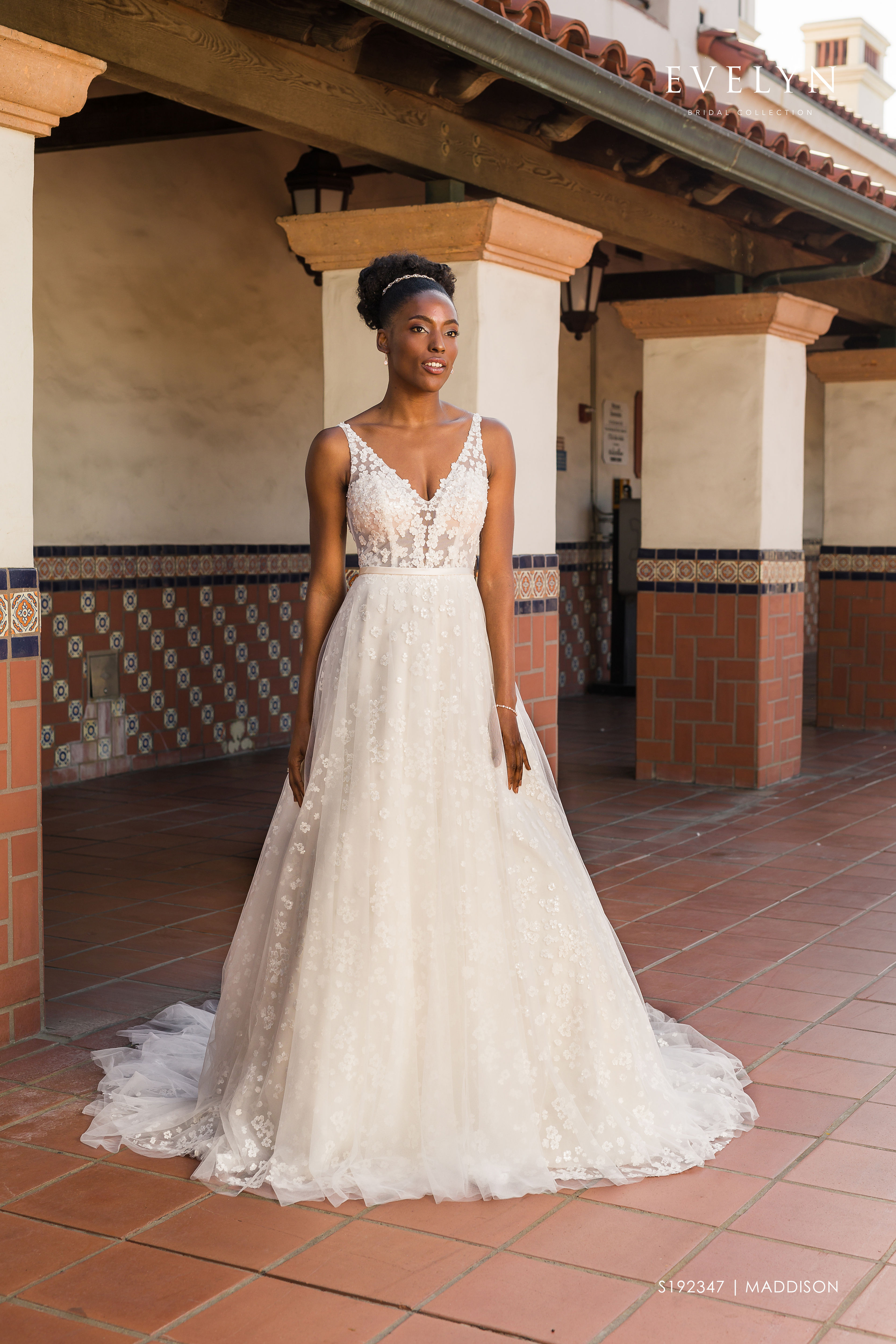 Maddison | S192347
Gown Info
Gorgeous sleeveless tulle ball gown with lace sheer bodice. The gown features elegant V neckline front and back, a satin belt, and is adorned with pearl beaded delicate hydrangea petals throughout the gown to chapel length train under a layer of ethereal misty tulle.

Material
Tulle

Lace

 

Color & Size
Ivory/Pearl/Ivory (Shown)

Ivory

 

Sizes available in 2-28  / 14W-32W