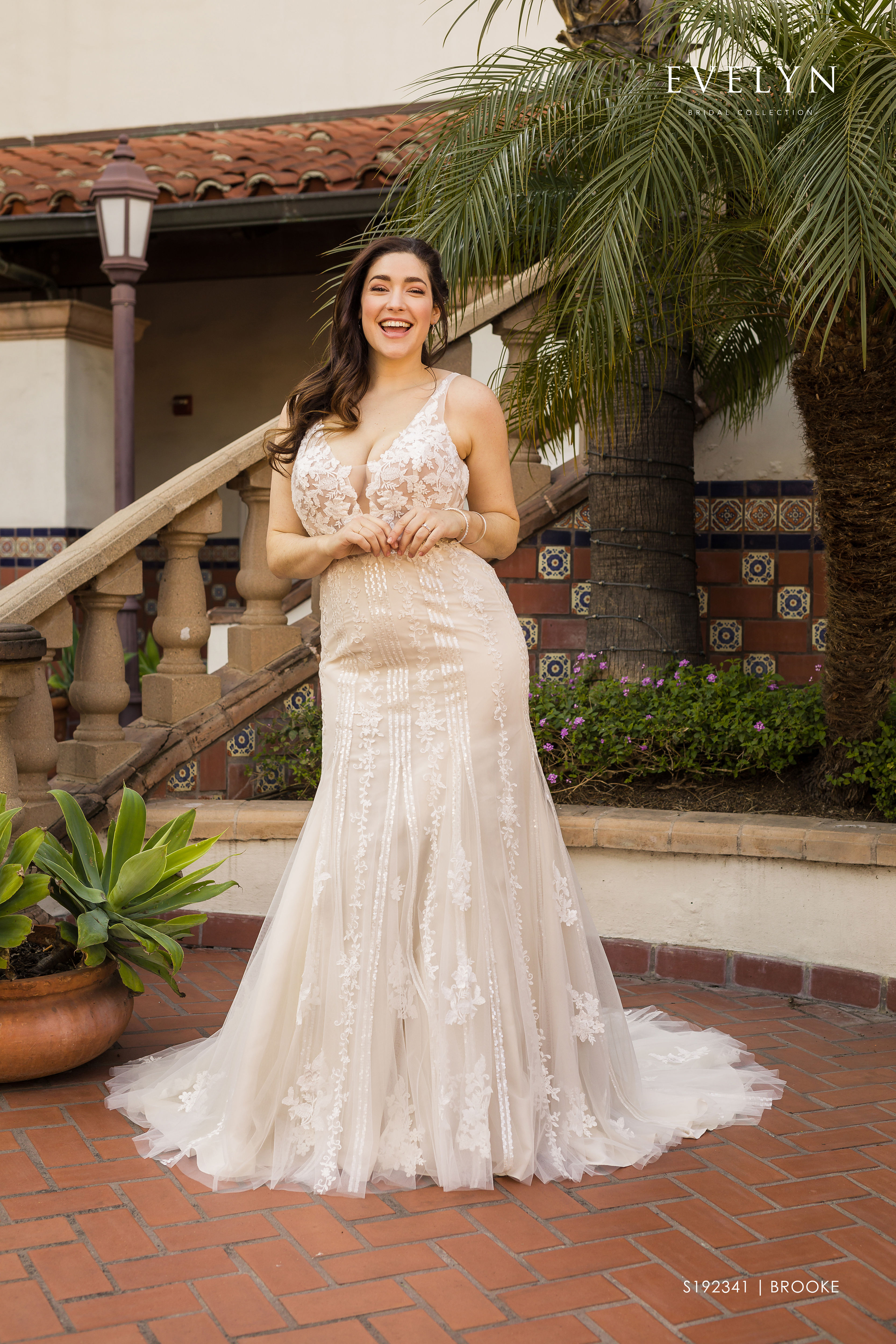 
Contemporary sleeveless tulle trumpet gown with lace sheer bodice. 

Brooke | S192341W
Gown Info
Contemporary sleeveless tulle trumpet gown with lace sheer bodice. The gown features a deep V front neckline and a plunging back on a sheer lace applique bodice, vertical pattern sequins all-over lace flares out to the chapel length train that is embellished with matching lace.

Material
Tulle

Lace

 

Color & Size
Ivory/Pearl/Ivory (Shown)

Ivory

 

Sizes available in 2-28  / 14W-32W