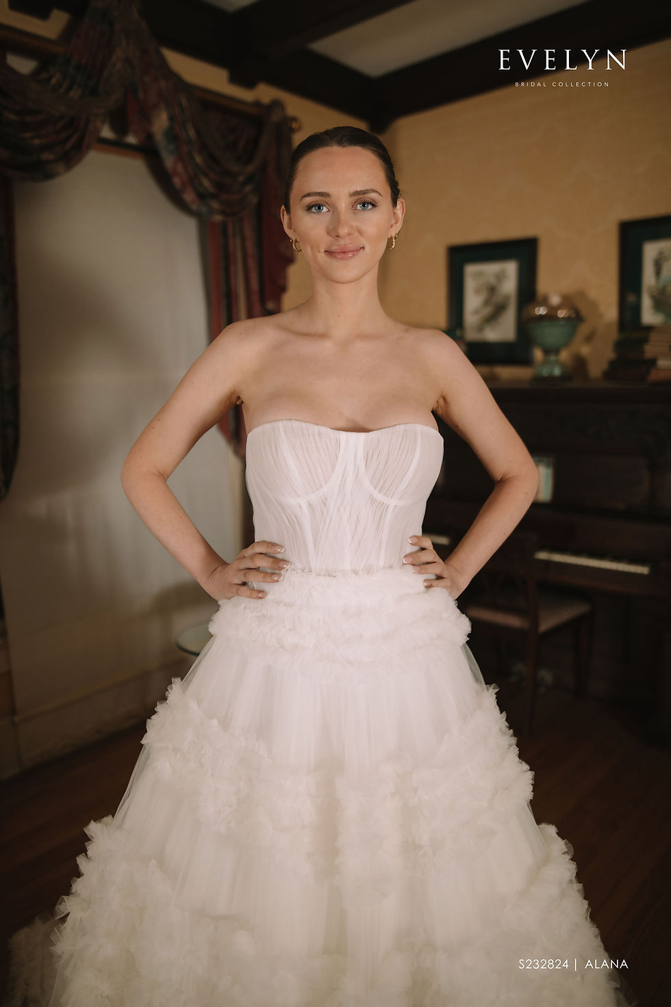 Thumbnail: Alana | S232824
Gown Info
In this enchanting tulle dress, the sweetheart neckline adds a touch of romance to the delicate design. The top of the dress features exquisite netting with artful pleats, while the flared skirt is adorned with four layers of cascading ruffles. Each layer of ruffles is composed of countless small ruffles, creating a dreamy and ethereal effect that will leave you feeling like you're walking on clouds.

Material
Tulle

Color & Size
Shown in Ivory/Ivory

Available Sizes: 2 - 28 / 14W - 32W