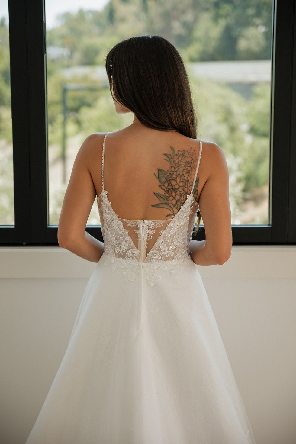 Thumbnail: Tessa | N25518
Gown Info
Envelop yourself in pure enchantment with this alluring gown, a symphony of delicate textures and sultry elegance. The upper body, graced with five ethereal layers of tulle, whispers of romance and mystery. As the gown cascades downward, the lower skirt entices with a captivating blend of tulle, lace, and satin, each layer meticulously interlined and lined for a fit that caresses your curves. Perfect for a night of unforgettable passion, this dress is your ultimate companion in making every moment breathtakingly beautiful.

Material
Lace/Tulle/Satin

Color & Size
Shown in Ivory/Nude

Also available in Ivory/Ivory

Available Sizes: 2 - 28 / 14W - 32W Size Chart