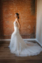 Thumbnail: Goldie | S242103
Gown Info
Embark on an enchanting journey with this gown that features delicate layers of tulle and lace intertwine to create a mesmerizing effect. Intricate embroidery, adorned with shimmering glass beads and transparent tubes, graces the deep V-neckline, infusing the silhouette with ethereal charm. With its sleek mermaid skirt and graceful straight train, this gown epitomizes timeless beauty on your special day.

Material
Tulle/Lace

Color & Size
Shown in Ivory/Light Champagne

Also available in Ivory/Ivory

Available Sizes: 2 - 28 / 14W - 32W Size Chart