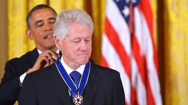 U.S. President Barack Obama awards the Medal of Freedom to former U.S. President Bill Clinton.