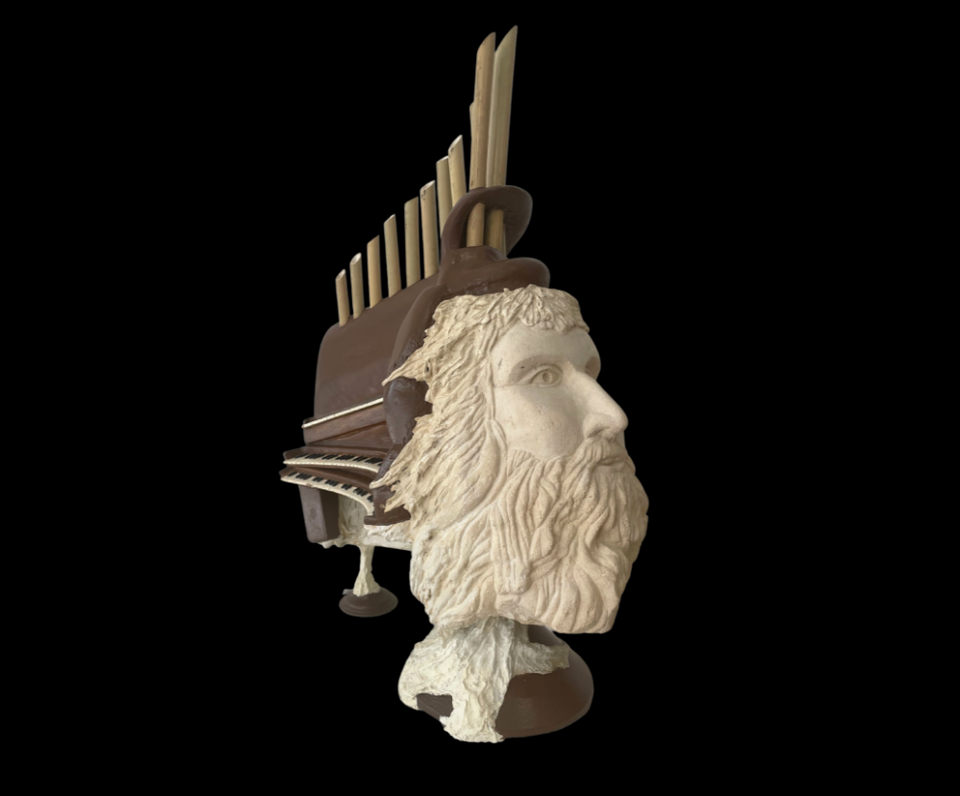 Sculpture en pierre visage et orgue – œuvre artisanale