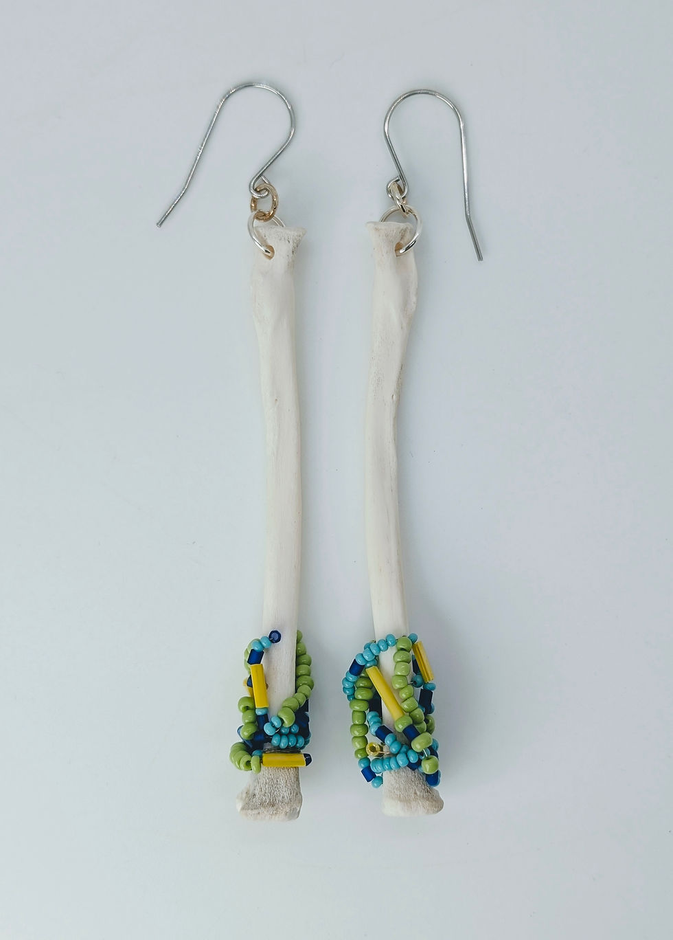 🧵 The "Heritage" Drops: Hand-Sewn Raccoon Radius & Vibrant Seed Beads