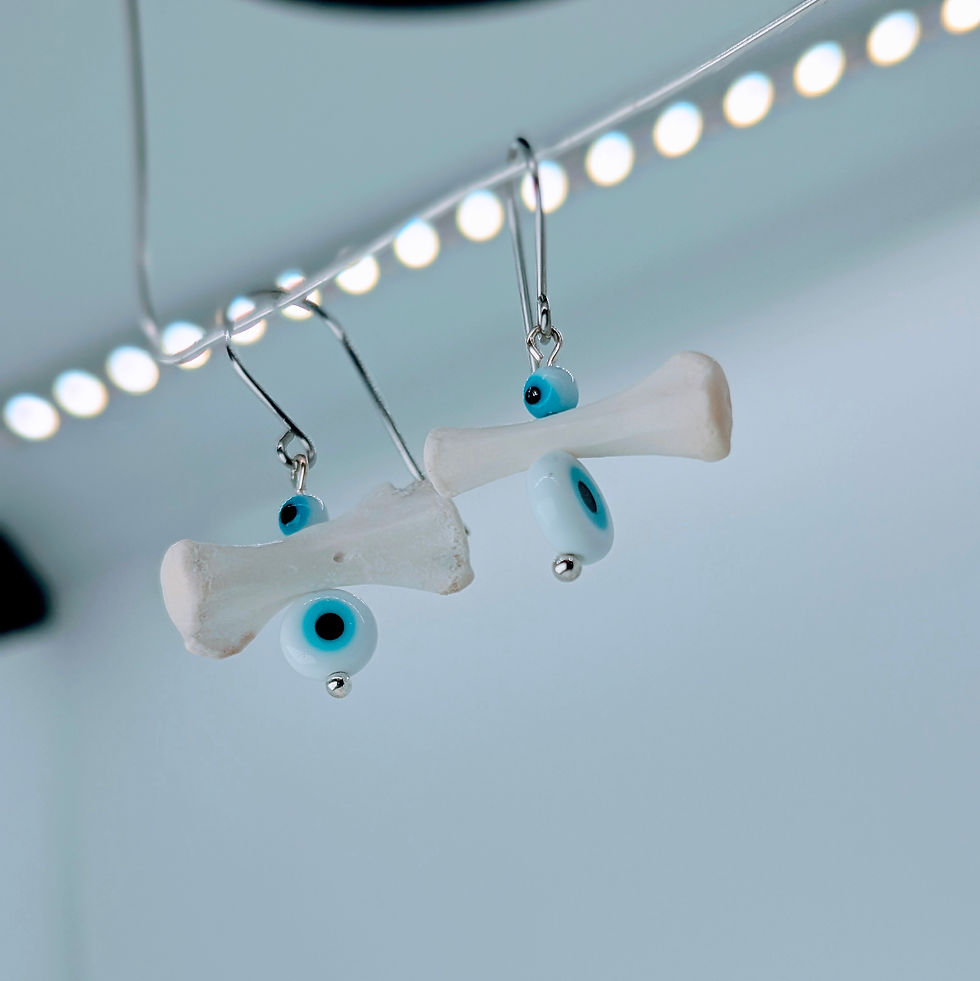 Thumbnail: Raccoon Caudal Bone Earrings with Evil Eye