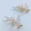 Thumbnail: Bullhead Catfish Vertebrae & Preciosa Czech Crystal Pearl Earrings