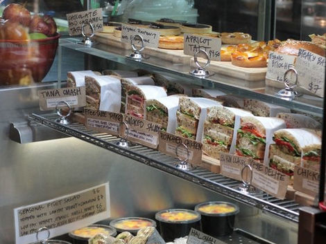 How can small grocery stores compete with the big superstores and hypermarkets?