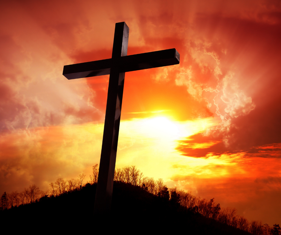 orange sky, silhouette of cross of Calvary on a hill