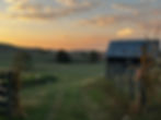 Colorful sunset over rolling farmland at Sunny Pointe Corn Maze in Jane Lew, West Virginia.