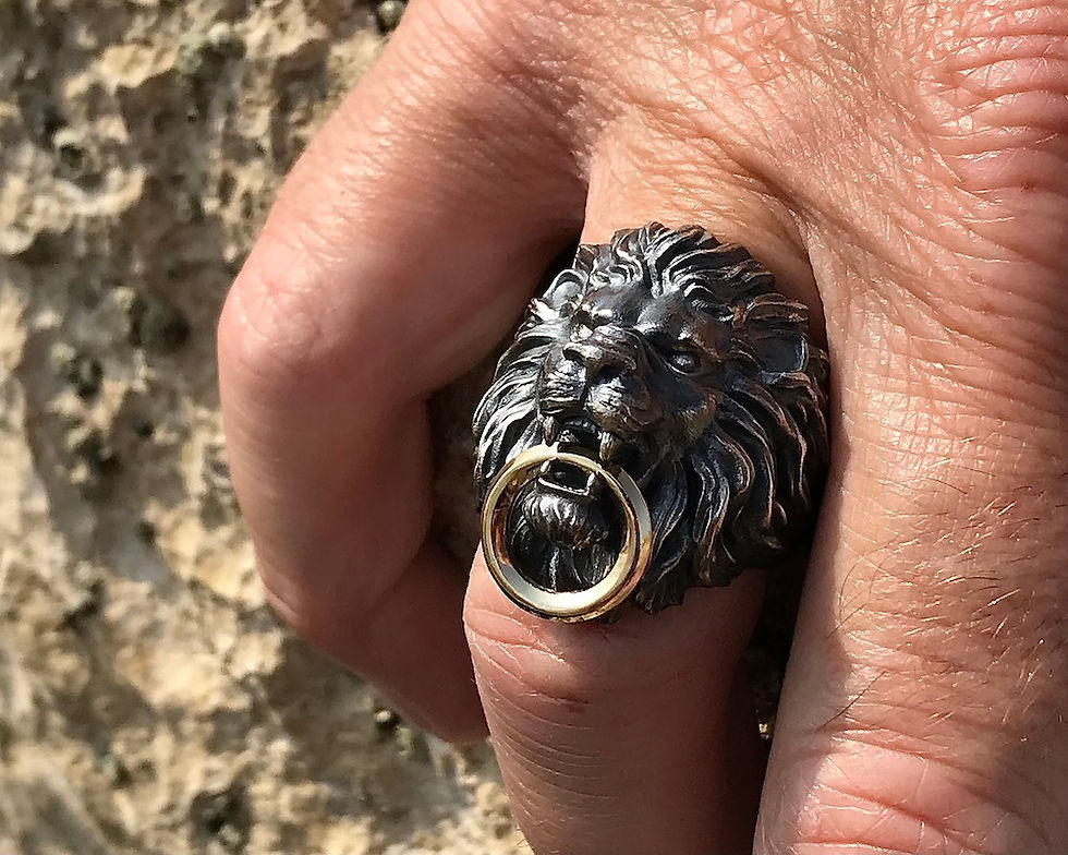 Big Lion with gold ring in the jaws. DECEM