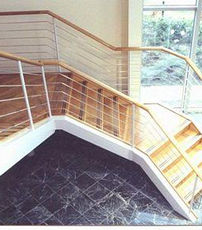 steel bannisters on wooden staircase