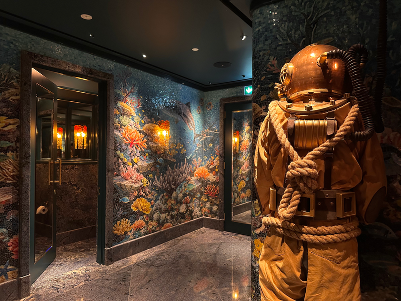 Sexy Fish male restroom mosaic walls and diver statue