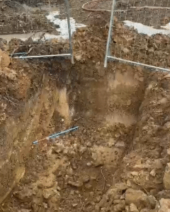 The drill bit breaking through during horizontal drilling. You can see the rotating drill bit as it cuts through the drilling fluid
