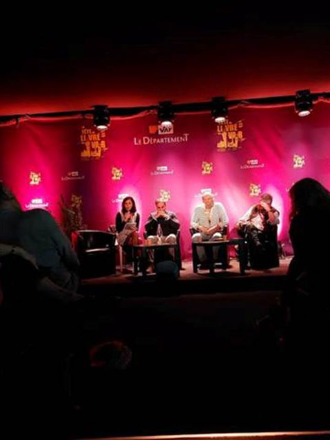 Panel discussion with visible text on stage. La Dépêche du Midi. STORM SONO