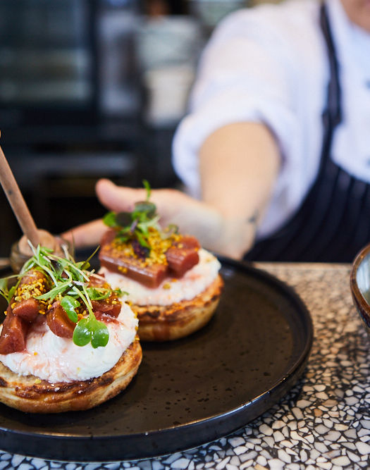 Plated brunch dishes being served at Second Home cafe in Eltham.