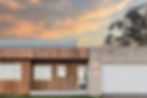Oyster limestone tuscan clad external feature wall with sunset
