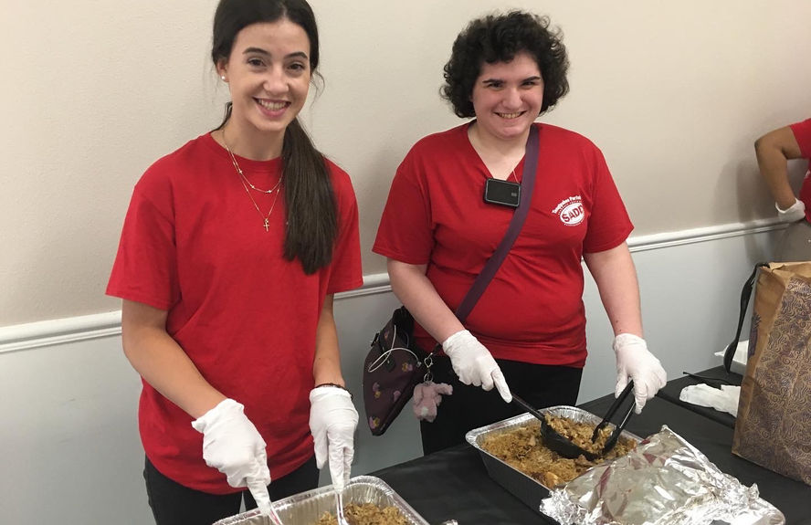 Olivia and Eliska serving food.JPG