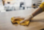 Wiping-down-a-wood-table-scaled_edited.jpg