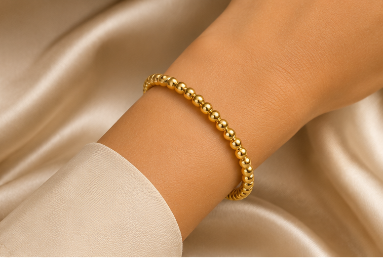 18K Gold Plated Beaded Bangle on a women's wrist