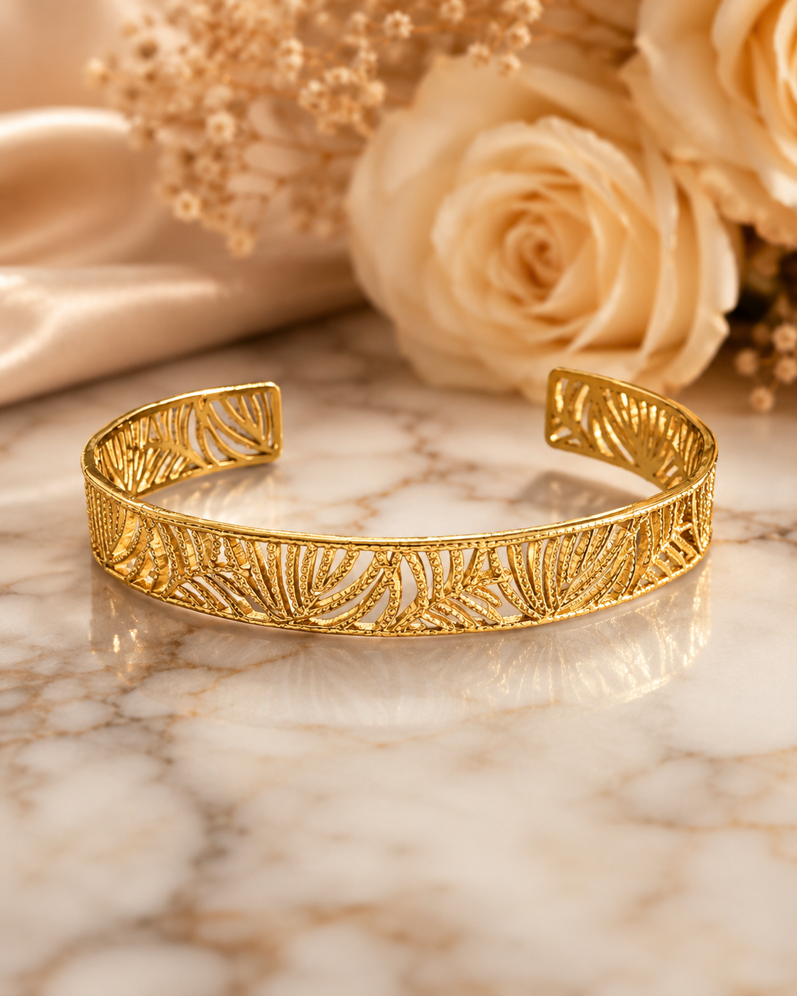 18K Gold Plated Botanical Bangle sat on white marble