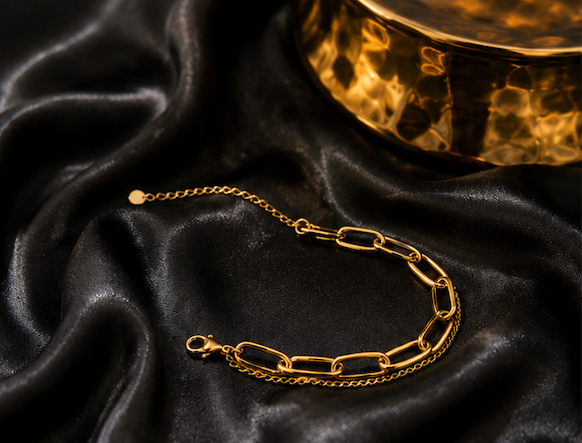 18K Gold Plated Dual Link Bracelet sat on black satin
