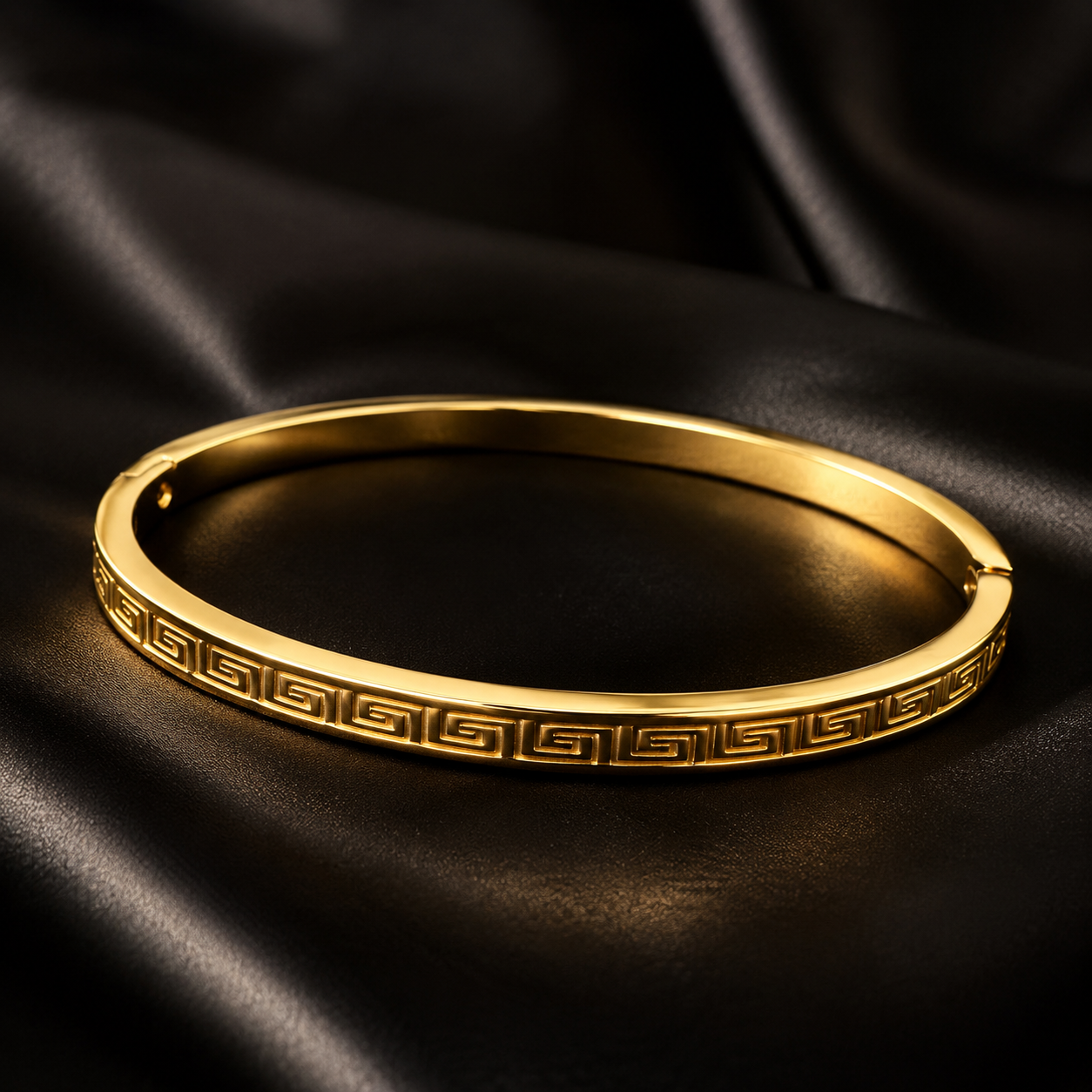 18K Gold Plated Slim Greek Key Oval Bangle on black satin
