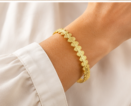 18K Gold Plated Scalloped Cuff Bangle on a women's wrist