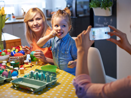 Parent and child enjoying a creative Easter egg decorating activity at My Kids Daycare in Houston, promoting family engagement, hands-on learning, and early childhood development in a nurturing daycare environment