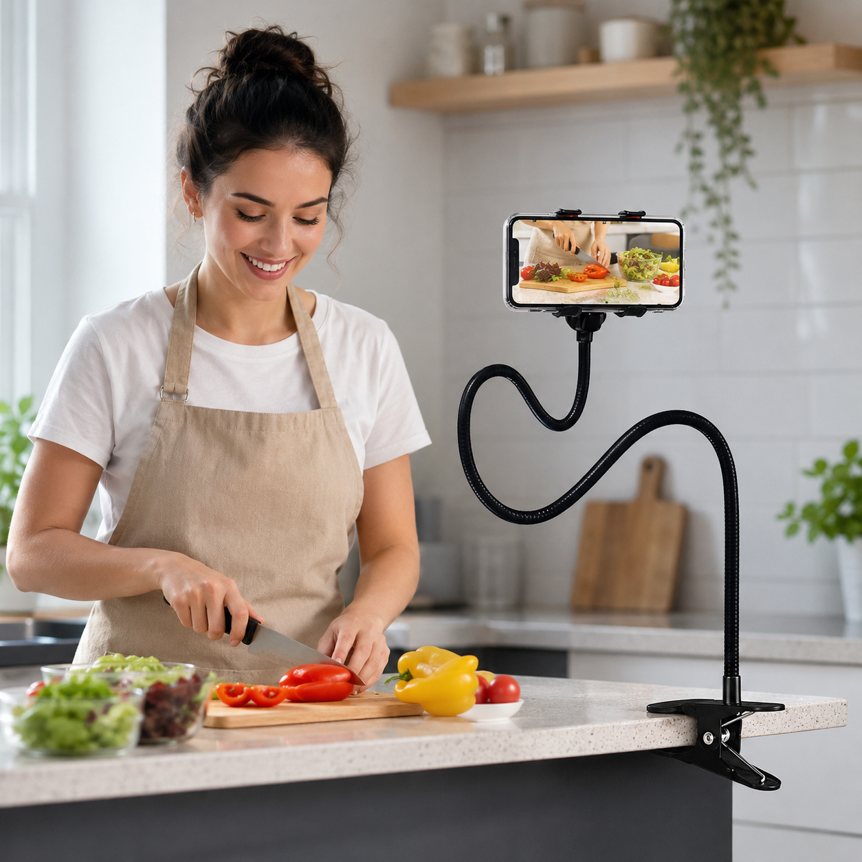 Woman cooking while using FlexiReach gooseneck phone holder to follow a recipe