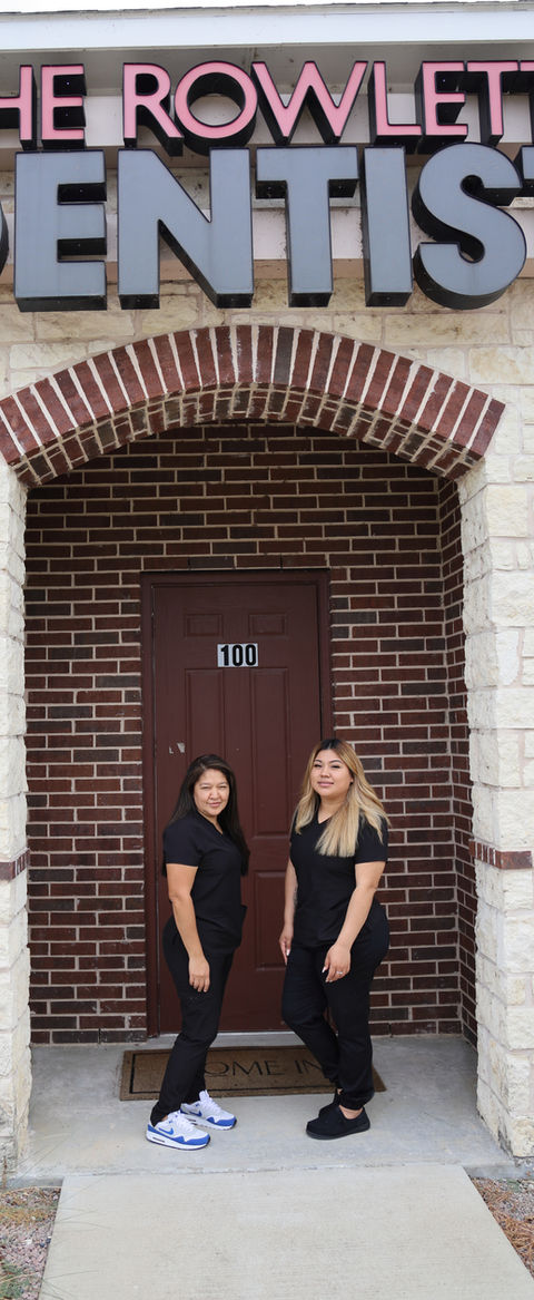 The Rowlett Dentist team members standing outside the Rowlett, TX dental office entrance