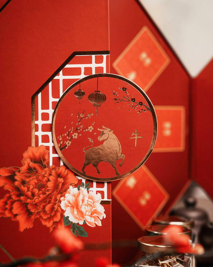 Close up of The Great Abundance gift box with golden ox clasp